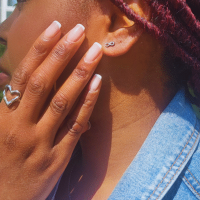 small dainty pair of silver infinity stud