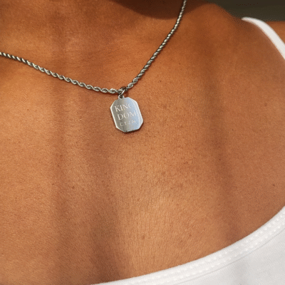 Kingdom CTZN Necklace around a brown skinned neck