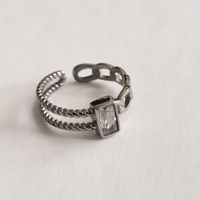 Open ring with chain and rope twist design with white CZ gem in the middle